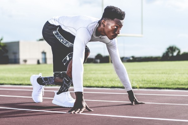 Photo of an athlete getting ready to run in a sprint race